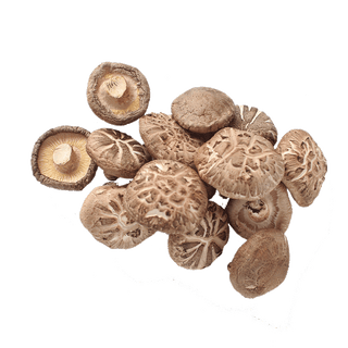 Whole shiitake mushrooms arranged on a pristine white surface