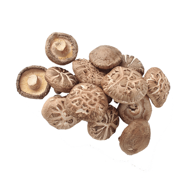 Whole shiitake mushrooms arranged on a pristine white surface